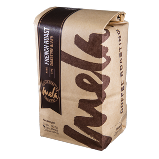 French Roast coffee bag with dark label and kraft wrap, featuring bold vertical French Roast text.