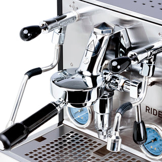 Close up of the Profitec RIDE espresso machine group head with chrome portafilter