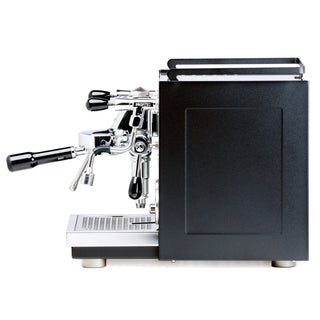 Side view of Profitec RIDE showing chrome portafilter, steam wand, and black machine body.
