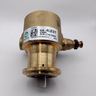 Close-up of a brass pump with an identification label displaying model and serial numbers.