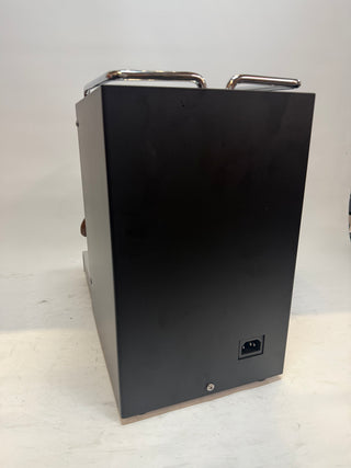 Open Box Lucca Solo espresso machine side view showing matte black housing and rear power inlet