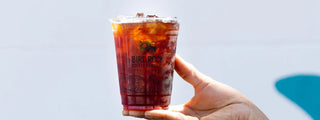 Cold brew iced coffee in a clear cup with ice and Bird Rock Coffee Roasters logo
