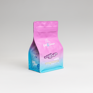 Kenya Kichwa Tembo coffee bag featuring a pink to blue gradient with white graphic and branding.