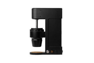Side profile of The Key compact coffee grinder with conical burr housing and adjustable grind dial
