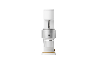 The Key compact coffee grinder head with white top cap and exposed burr housing.