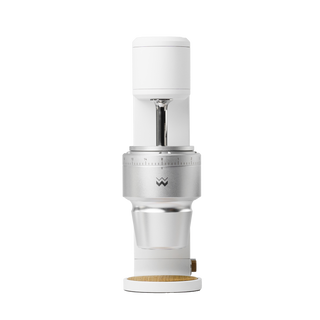 The Key compact white coffee grinder head with exposed conical burr mount and adjustment ring