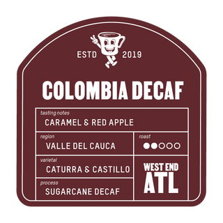 Colombia Decaf label on maroon coffee packaging showing caramel and red apple notes Valle del Cauca sugarcane decaf