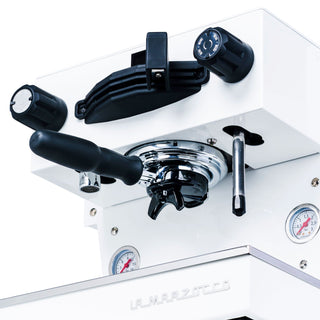 Top front view of yellow La Marzocco espresso machine with two large dials and a central lever.