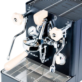 Lelit Bianca V3 espresso machine front detail with wooden portafilter handles and gauge