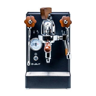 Front view of the Lelit Flow Control Kit showing two walnut knobs and a pressure gauge on the espresso machine