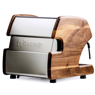 La Spaziale espresso machine with curved wooden end panels and chrome front.
