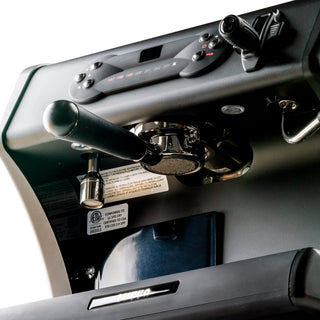 Close view of LUCCA A53 Pro espresso machine top with portafilter attached and steam wand.