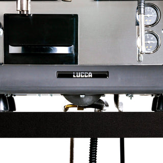 Lower front view of LUCCA espresso machine with visible plumbing tubes beneath the control area and LUCCA logo.