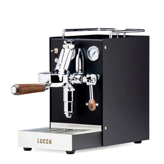 Open box LUCCA Solo espresso machine with chrome fittings and wooden portafilter handles