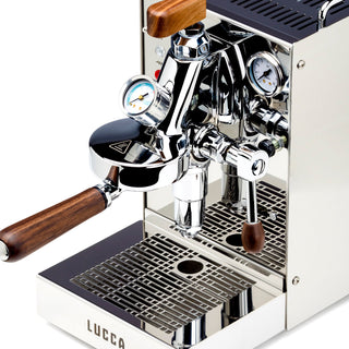 Side view of LUCCA Solo espresso machine highlighting chrome finish, E61 head, wooden knob, and gauge.