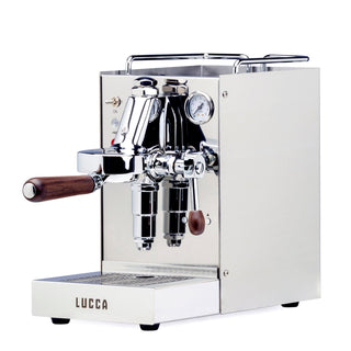 LUCCA Solo espresso machine with dual chrome group heads and wooden handles on a white base