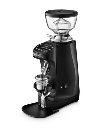 Black Mazzer Mini G espresso grinder viewed from a slightly angled side showing the hopper and dial.