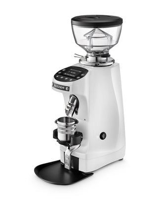 Angled white Mazzer Mini G grinder with hopper lid and portafilter cradle visible