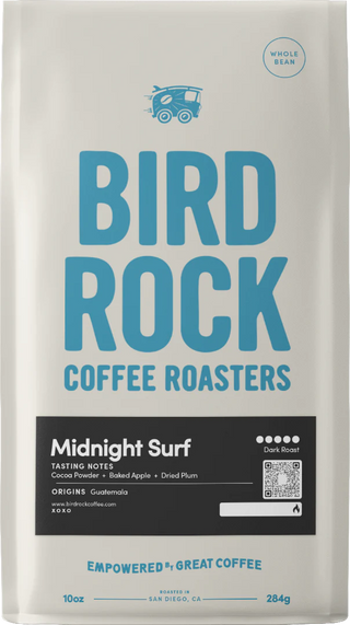 Midnight Surf coffee bag from Bird Rock Coffee Roasters with bold blue logo and tasting notes cocoa powder baked apple and dried plum