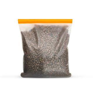Milky Way Espresso Blend coffee beans in a clear standup bag with an orange resealable zipper