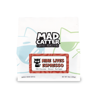 Nine Lives Espresso label on a white coffee bag with a bold red border and a black cat illustration.