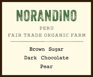 Norandino Peru Fair Trade Organic Farm coffee label on cream background with green NORANDINO text and brown border.