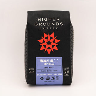 Mayan Magic Espresso bag from Higher Grounds Coffee with purple label against a plain backdrop
