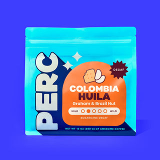 Decaf Colombia Huila coffee bag with orange label and decaf graphic on bright blue package.