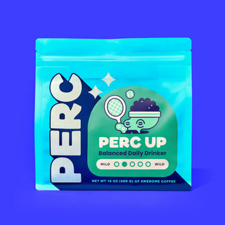 PERC UP Balanced Daily Drinker coffee bag with a green round label and whimsical illustration on purple background