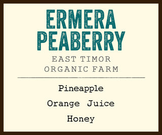 Ermera Peaberry coffee label from East Timor featuring Organic Farm and flavor notes pineapple orange juice honey