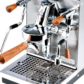 Close up of Profitec JUMP espresso machine with wooden portafilter handles and polished chrome group head.