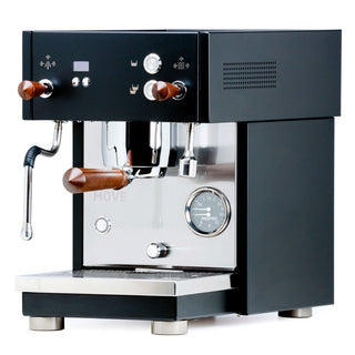 Front view of Profitec MOVE espresso machine with black control panel, copper knobs, steam wand, and chrome group head
