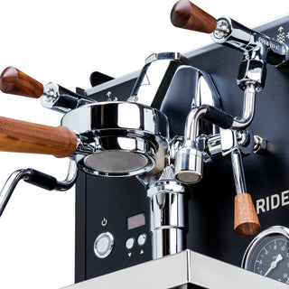Close up of Profitec RIDE top section showing wooden portafilter handles and polished chrome fittings