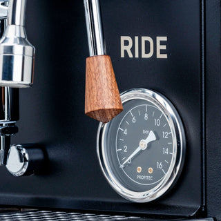 Profile view of Profitec RIDE espresso machine showing wood and chrome details and the RIDE label.