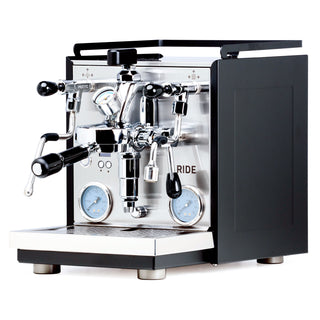 Profitec RIDE espresso machine front view with dual group heads, gauges, and chrome finish. (Black)