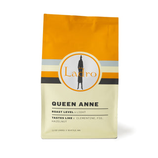 Queen Anne coffee bag with orange top and circular Ladro logo on the label.