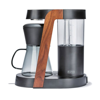 Side view of Ratio Eight Series 2 coffee maker with glass carafe and wooden frame