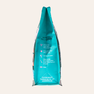 Full vertical view of turquoise Goshen Coffee bag with brewing tips printed along its surface