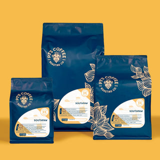 Blue Southpaw Espresso PT's Coffee bag against a bold yellow background