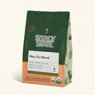 Dark green Way Out Blend Organic coffee bag with a circular roast seal and partial white label