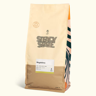 Magdalena coffee bag with cream packaging, a round roast stamp, and a white label at the bottom.