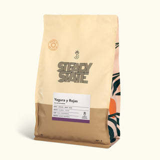 Yagura y Rojas Yellow Bourbon bag angled to reveal a white information sheet with purple border on the front