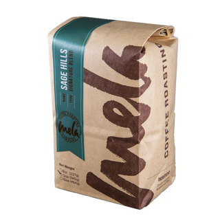 Sage Hills Blend coffee bag with teal side label, hinting at sage cedar and warm spices.