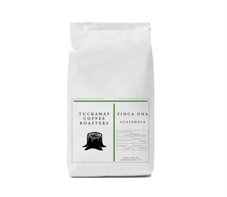 Bag of Guatemala Finca Ona coffee from Tuckaway Coffee Roasters with a white bag and green outlined label.