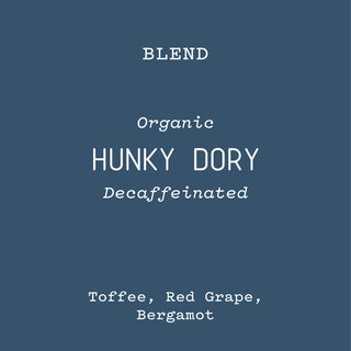 Front of blue Hunky Dory Decaffeinated blend packaging with large tan circle label