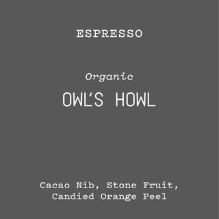 Owl's Howl espresso packaging on a dark gray background with Organic label and bold OWL'S HOWL text