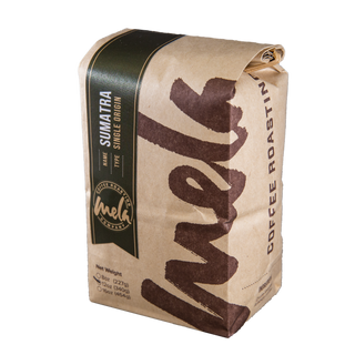 Sumatra Mandheling organic coffee bag with dark label and earthy paper wrap.