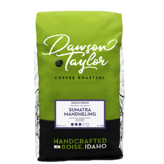 Green Dawson Taylor Sumatra Mandheling coffee bag with white script logo and a purple framed single origin label