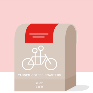 Time and Temperature espresso bag by Tandem Coffee Roasters with red backdrop beige packaging and bicycle illustration.
