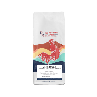 White coffee bag featuring Red Rooster Coffee branding and a bold rooster logo.